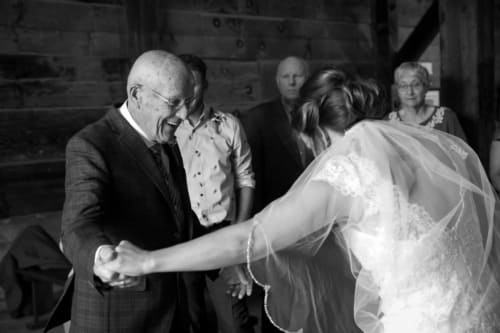 Grandpa sees his grand daughter and is amazed at the barn wedding in Strathmore