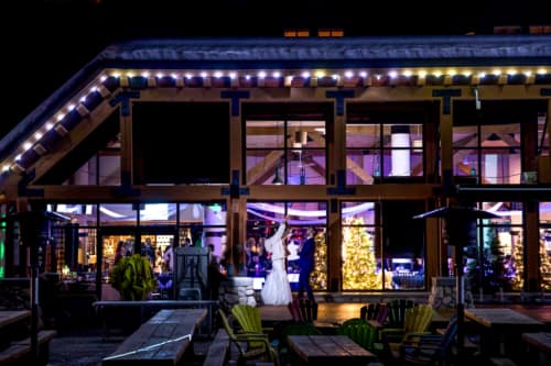 Bride and Groom celebrate outside their venue during reception